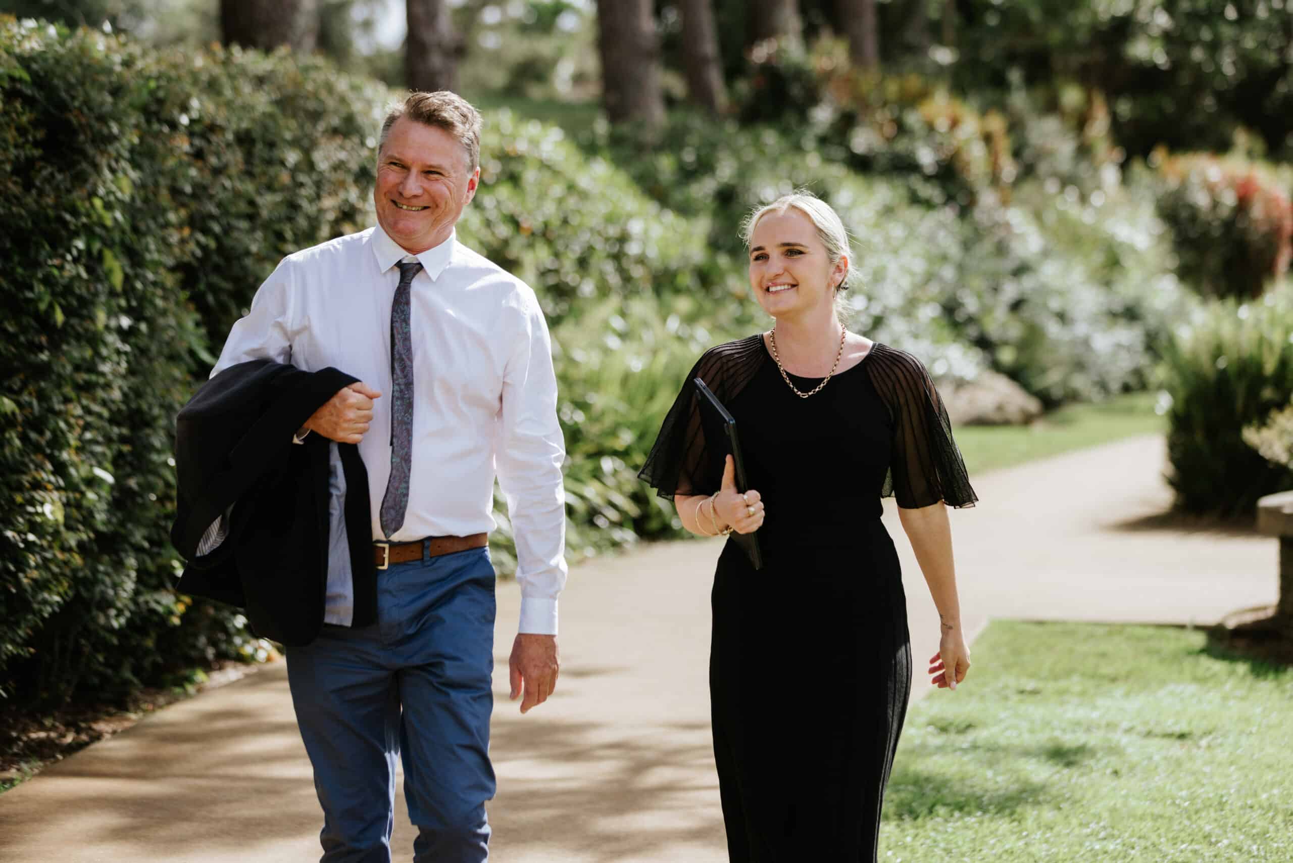 Happy Couple While Walking in Sunshine Coast - Greenhalgh Pickard