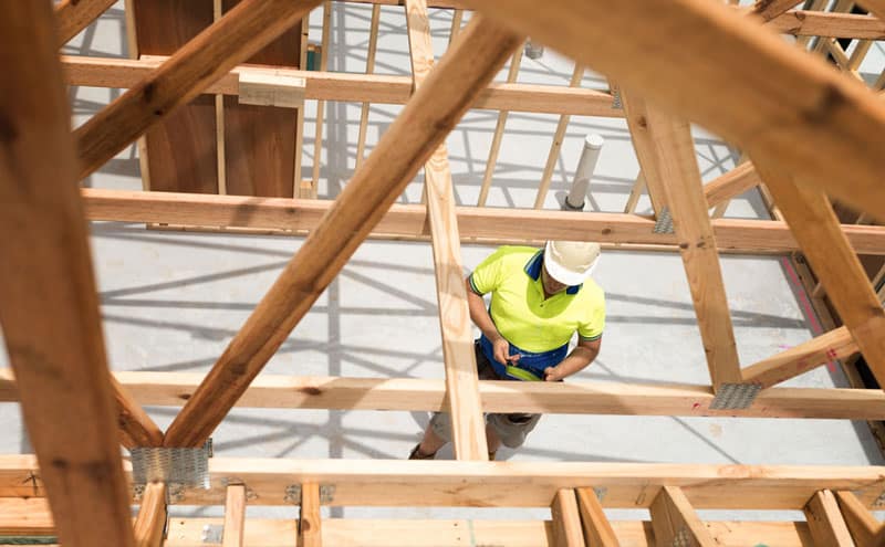 house frame over the top of a concrete slab