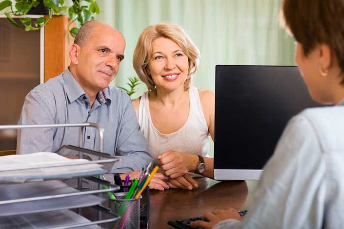 couple discussing their will with Greenhalgh Pickard