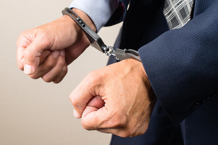 Businessman With Handcuffs Accused Of Fraud