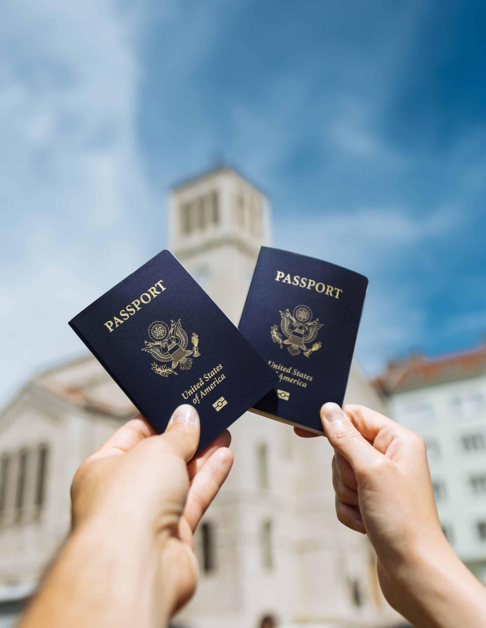 Couple Holding up their Passports in Sunshine Coast