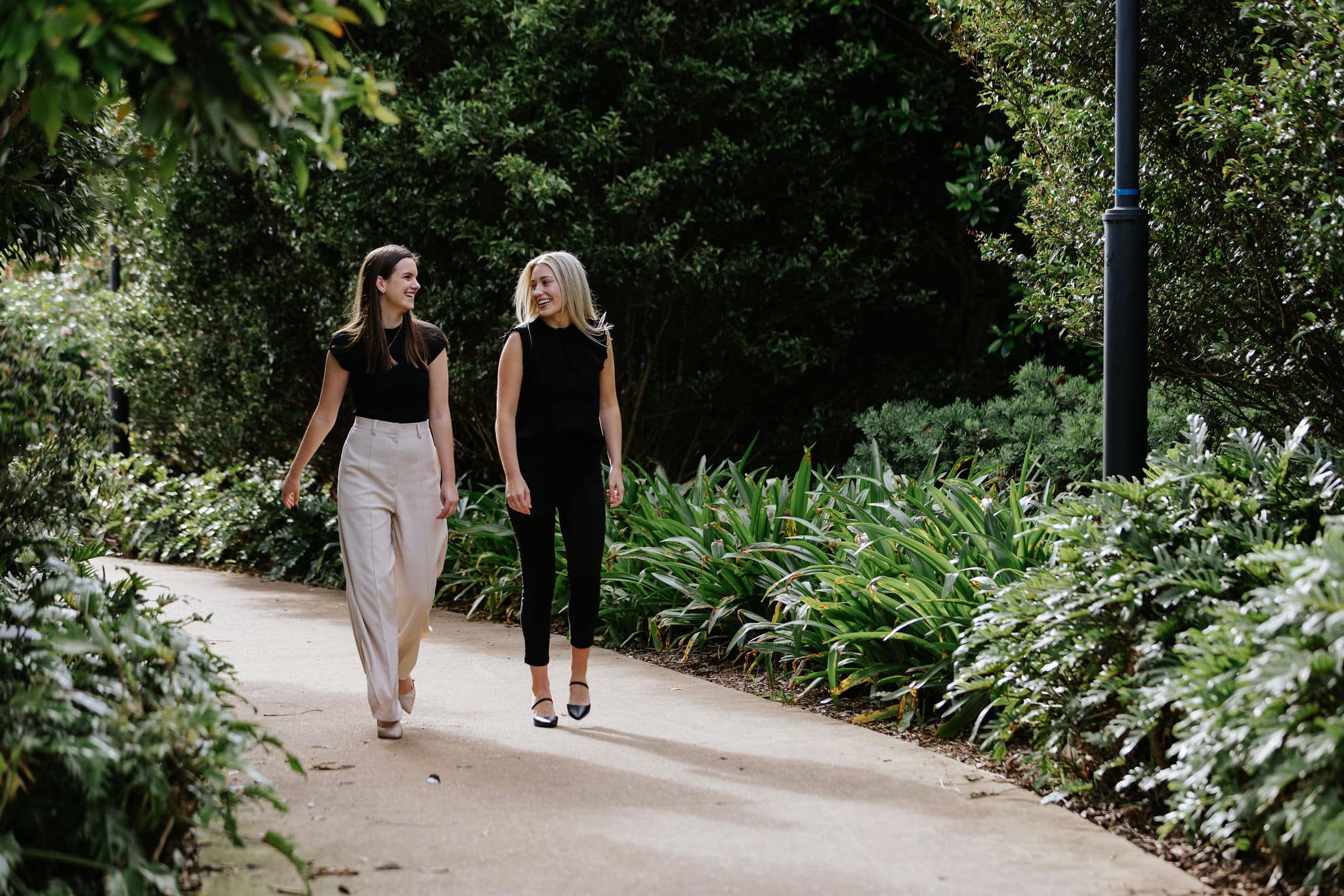 Two Women Solicitors Happy while Walking at the Park in Sunshine Coast