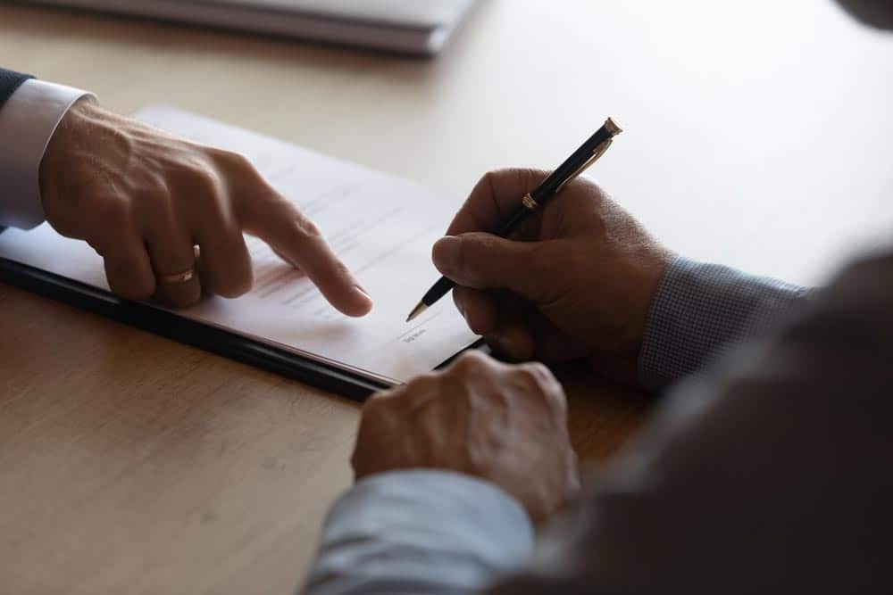 Solicitor Presenting A Document For Sign