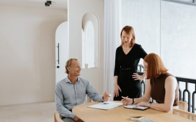 Three lawyers chatting in bright room