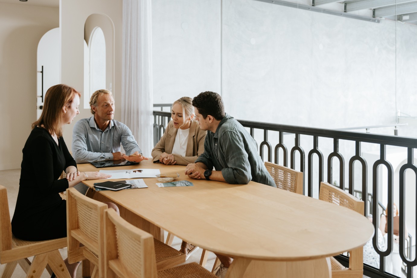 Legal team sitting around oak table