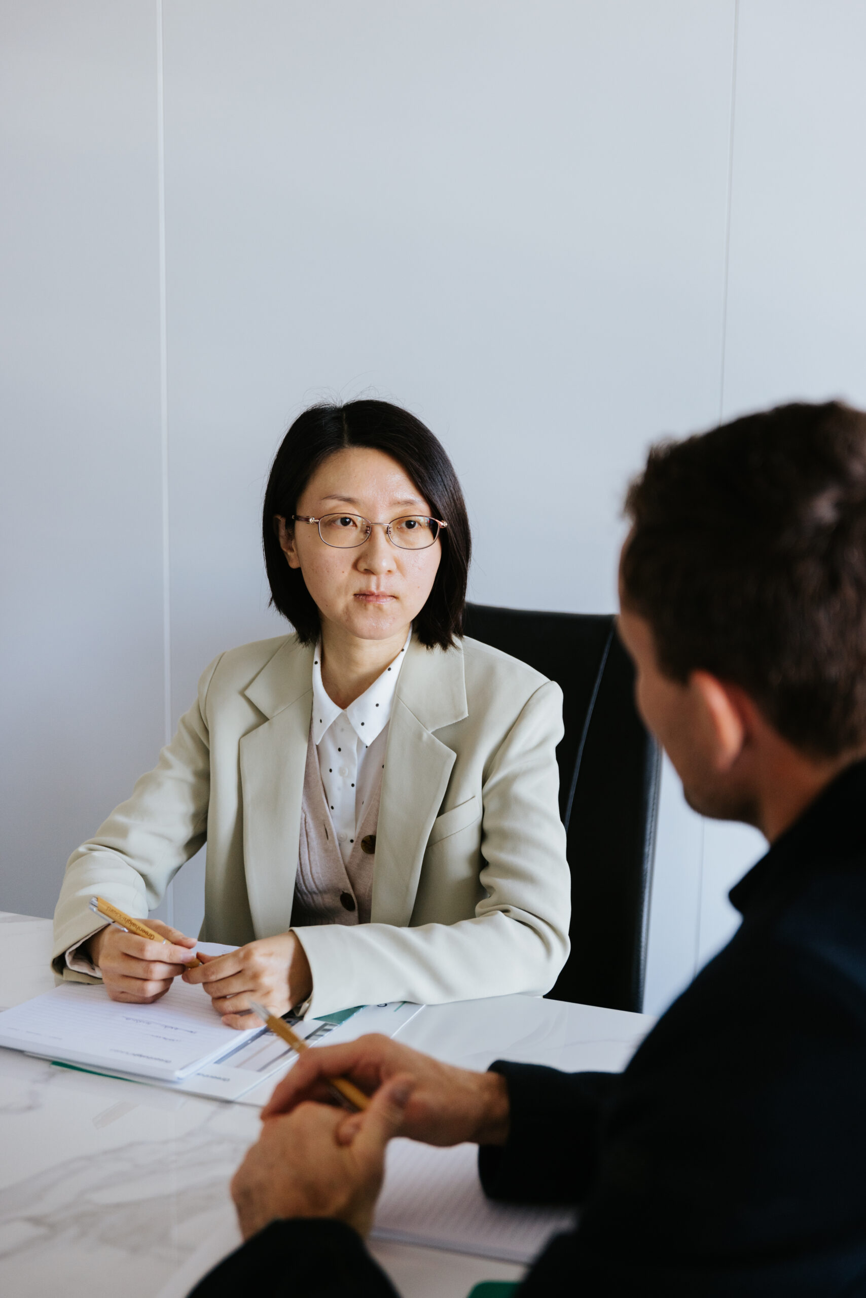 Brunette male Accountant speaking with client
